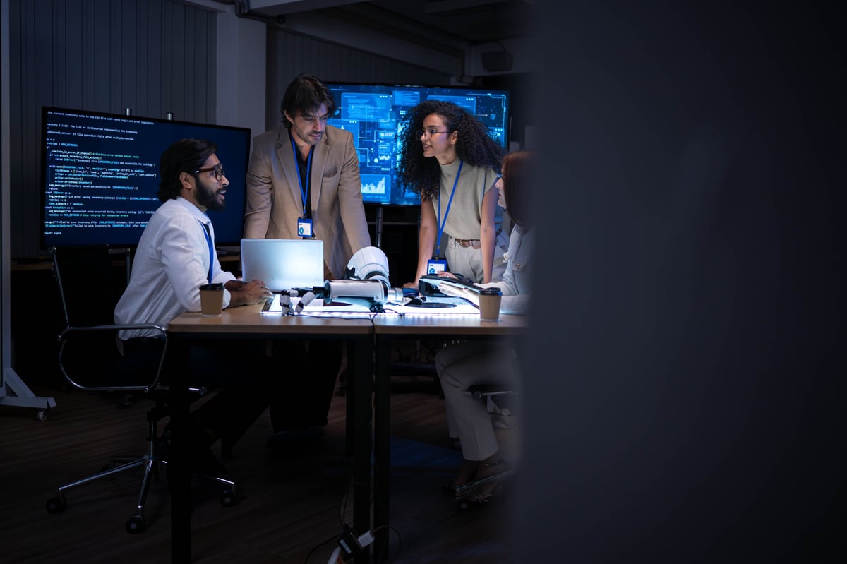Technology professionals presenting digital analytics during corporate strategy meeting